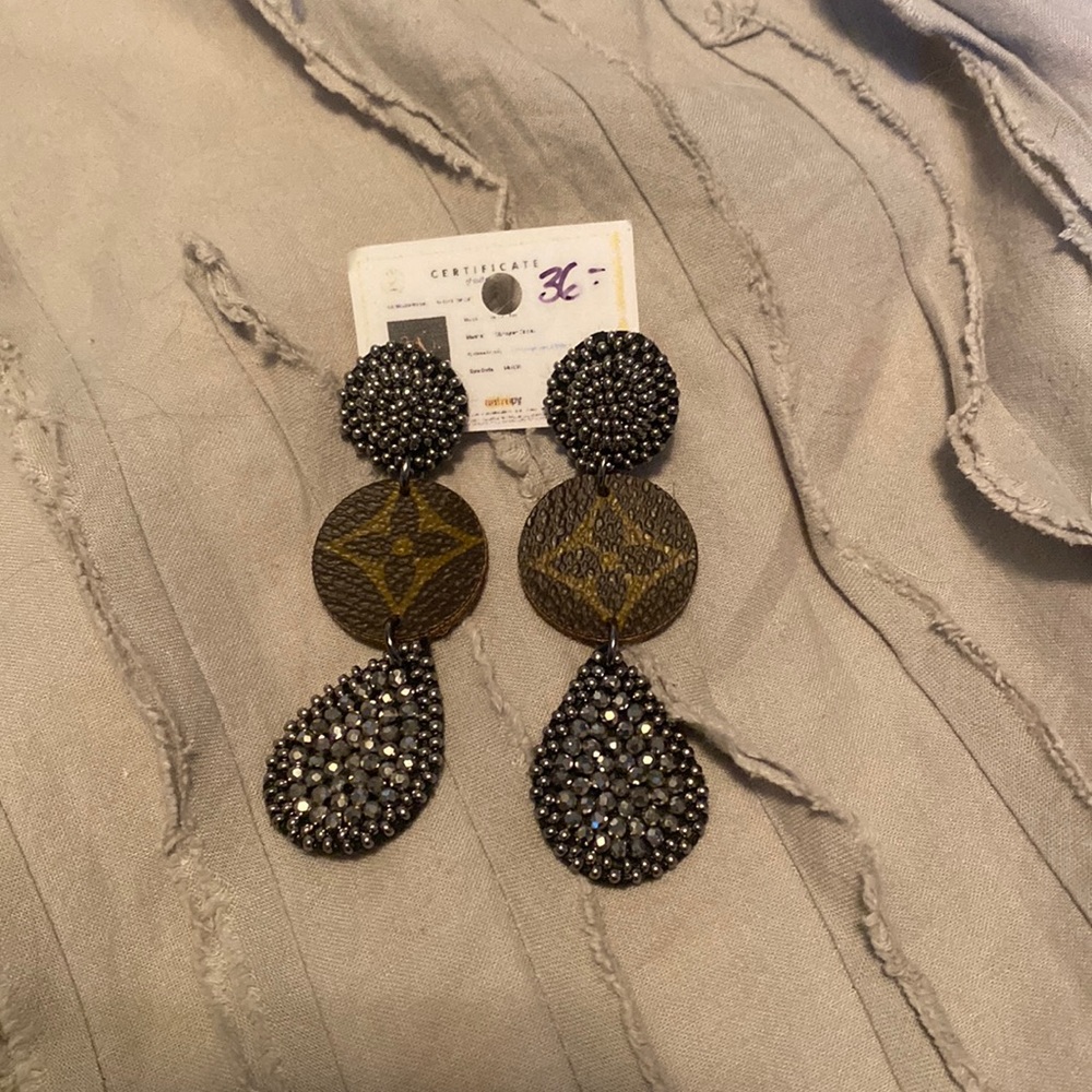 Silver beaded repurposed L*V* earrings. Still has tag and certificate.